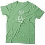 A green leaf-inspired unisex t-shirt with the phrase "LEAF ME" will be replaced with the product name: ”LEAF ME" Plant | Sleeve Unisex T-Shirt.