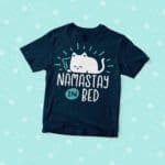 A Kid's "Namastay In Bed" Lazy Cat Jersey Tee with the phrase "Namastay in bed.