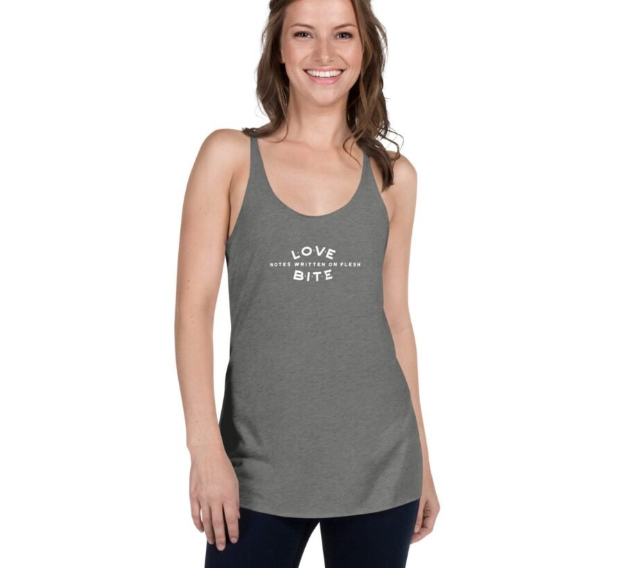 A woman wearing a grey tank top with the word love on it, LOVE BITE Women's Racerback Tank.