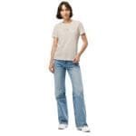 A woman wearing the Feeling Text Design Embroidery Women’s relaxed tri-blend t-shirt.