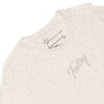 A women's relaxed tri-blend t-shirt with the Feeling Text Design Embroidery.