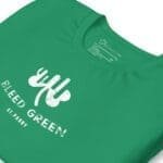 A Bleed Green St.Patrick's Day unisex t-shirt with a white logo on it.