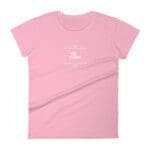 A women's pink t-shirt featuring the word Flow With Heart.