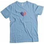 A light blue Independence Day 4th July "HEART" Unisex Heavy Cotton Tee with an American flag heart on it.