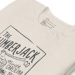 The lumberjack logo on a LUMBERJACK A Life Among The Ever Greens Unisex T-Shirt.