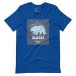 A blue t-shirt featuring THE SPIRIT OF FREEDOM ALASKA bear.