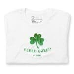A Bleed Green St. Patrick's Day unisex t-shirt with a green shamrock on it.