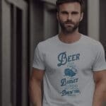 A man wearing a Beer Got Fired, It Was Barley Good and Lacked Brewtal Skills Unisex T-Shirt.