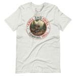 A white Grill & Chill Camping Thrill unisex t-shirt with a camping cabin and "Grill and Chill" slogan on it.