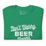 Introducing the "Dont Worry Beer Happy" Unisex T-Shirt, a perfect choice for St. Patrick's Day. This green shirt showcases the playful slogan "Don't Worry Beer Happy" in clean white print.