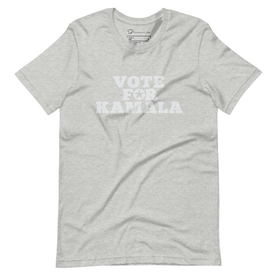 A unisex T-shirt in gray featuring the words "VOTE FOR KAMALA" printed in white uppercase letters on the front, ideal for showing your support during Elections 2024.