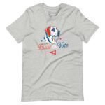 The "Paws to Vote | Elections 2024" unisex t-shirt is a gray tee featuring a dog illustration above the text "Paws to Vote" in red and blue, complemented by red and blue stars and a small red pennant—ideal for showing support during Elections 2024.