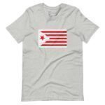 A light gray, unisex "Star and Stripes Red" t-shirt featuring a flag design with a red star and red stripes on a white background. Perfect for showing your support during Elections 2024.