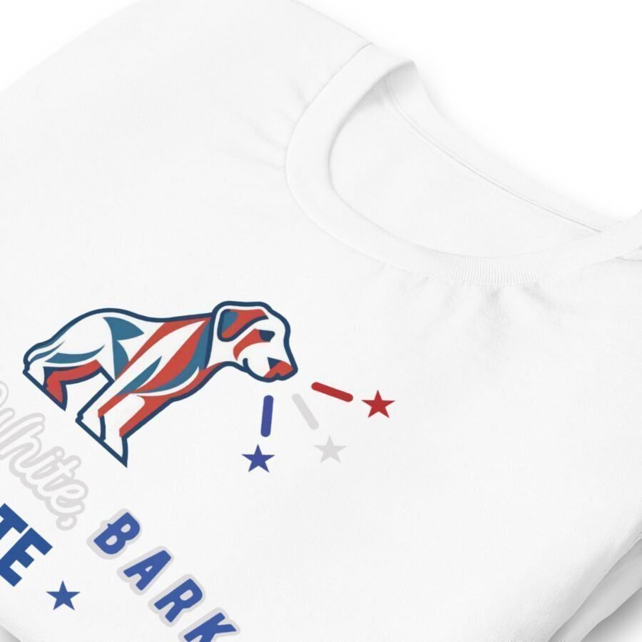 A unisex t-shirt in white, showcasing a stylized dog illustration adorned with red, white, and blue hues. The design incorporates stars and partially visible text at the bottom.