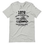 Gray unisex heavy cotton tee featuring a black graphic of a vintage Classic Car VW with text reading "1978 Retro Classic Car Authentic RCC Reg. TM. This is how I roll." Registered Trademark. Product name: Classic Car VW | I Roll | Unisex Heavy Cotton Tee.