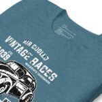A teal Air Cooled VW | Old School | Unisex Heavy Cotton Tee featuring a black illustration of an old school vintage car and white text reading "AIR COOLED VINTAGE RACES" along with additional design elements.