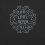 On a dark background, the unisex t-shirt features stylized text that says "God's Love Never Fails," encircled by decorative patterns and stars, beautifully embodying the spirit of faith.