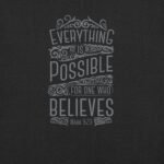 The unisex t-shirt design features text on a dark background that reads, "Everything is possible for one who believes. Mark 9:23," adorned with decorative flourishes.